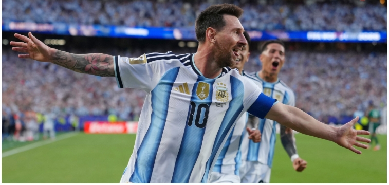 Lionel Messi celebrating after scoring a FIFA World Cup goal, becoming the all-time leading scorer in the tournament’s history.